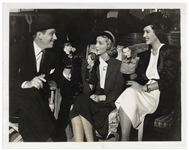 10 x 8 Glossy Photo From 1937 Featuring Melvyn Douglas, Virginia Bruce and Margaret Lindsay Holding Three Stooges Hand Puppets -- Very Good Condition
